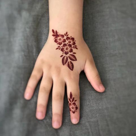 Single bloom and leaf spray on the hand