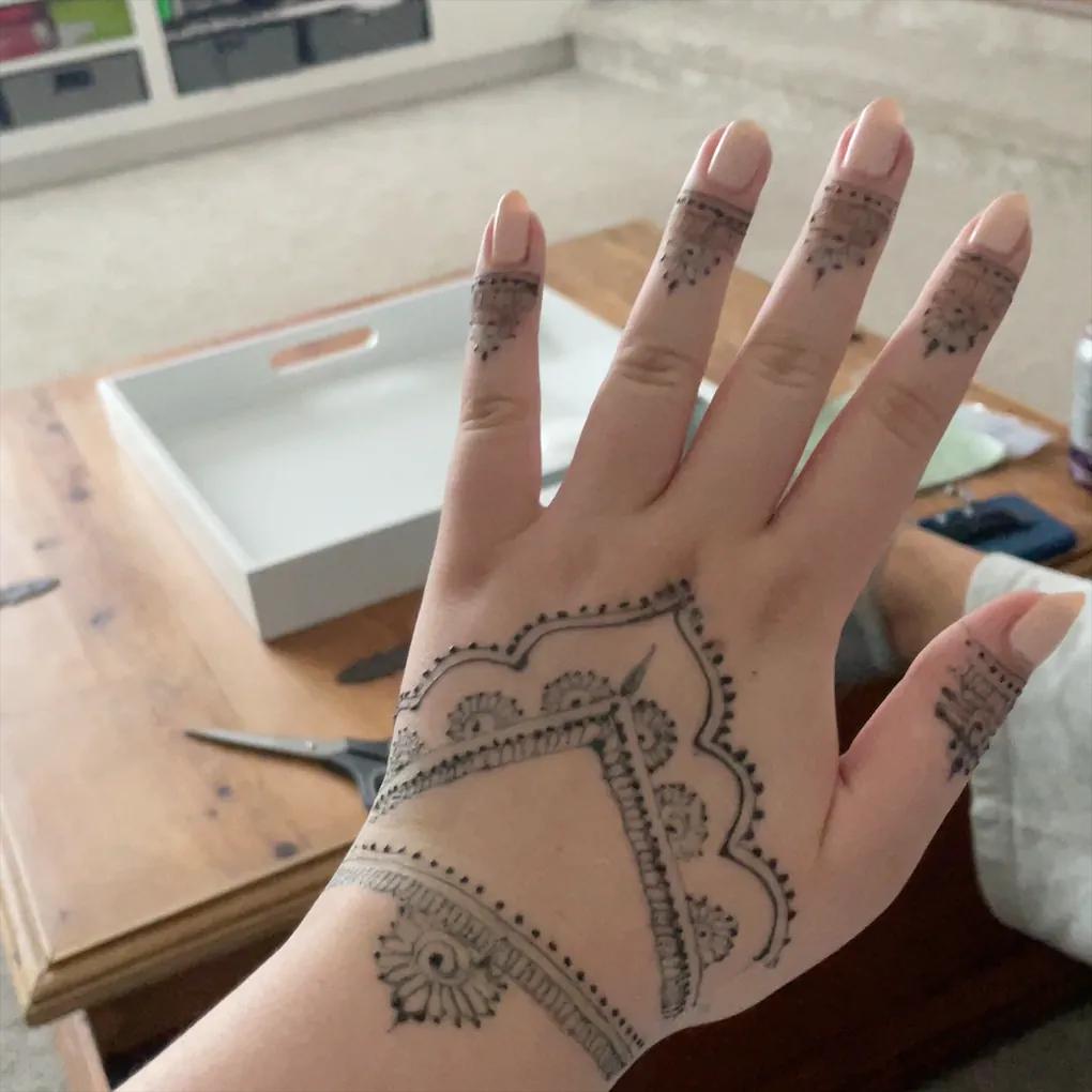 Bridal rose henna covering the full hand